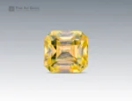 0.25 carat emerald-cut yellow stibiotantalite gemstone from Afghanistan.