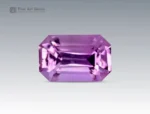 A 0.5-carat emerald-cut pink topaz with a delicate light pink hue and sharp facets, mined in Pakistan.