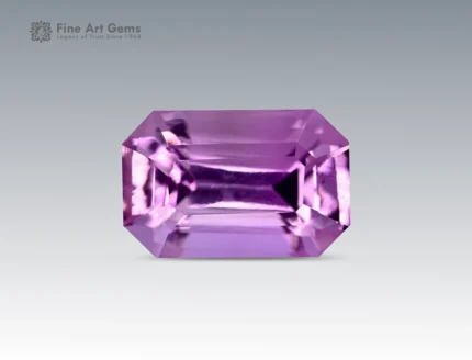 A 0.5-carat emerald-cut pink topaz with a delicate light pink hue and sharp facets, mined in Pakistan.