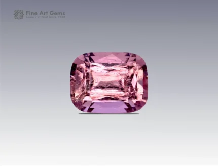 A 1.7-carat cushion-cut pink topaz with a soft rosy-pink color and sparkling facets, mined in Pakistan.