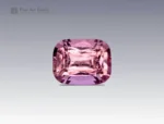 A 1.7-carat cushion-cut pink topaz with a soft rosy-pink color and sparkling facets, mined in Pakistan.