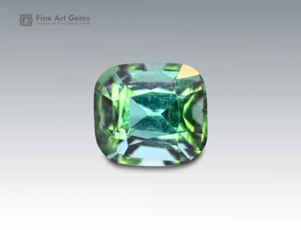 Cushion-cut blue-green tourmaline gemstone weighing 2.02 carats from Afghanistan, with mixed tones and fine brilliance.