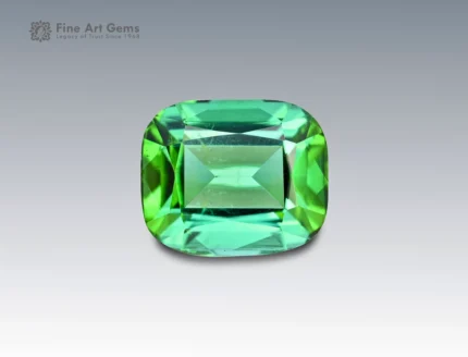 Cushion-cut green tourmaline gemstone weighing 2.85 carats from Afghanistan, with vibrant color zoning and fine clarity.
