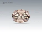 A 9.40-carat topaz with a custom fancy cut, showing a soft champagne color and brilliant sparkle, mined in Pakistan.