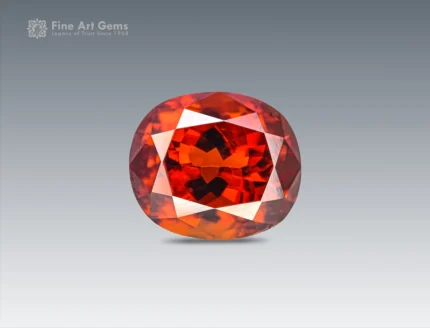 Oval-cut red bastnaesite gemstone from Pakistan.