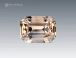 Magnificent 10.55 carat emerald-cut topaz from Pakistan, showcasing a delicate champagne hue with sharp step facets and radiant brilliance.