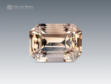 Magnificent 10.55 carat emerald-cut topaz from Pakistan, showcasing a delicate champagne hue with sharp step facets and radiant brilliance.