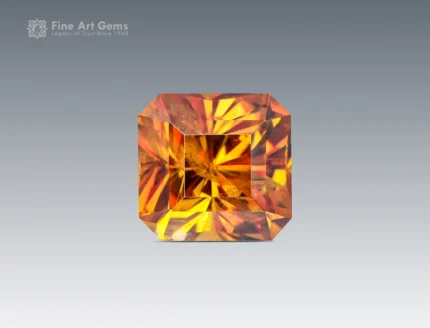 2.25 carat Asscher cut sphene (titanite) gemstone from Pakistan, showing golden-orange color and strong rainbow brilliance