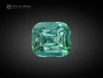 A 5.55-carat cushion cut tourmaline gemstone from Afghanistan with a greenish-blue sparkle, ideal for rings, pendants, and fine jewelry