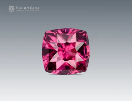 Cushion-cut rhodolite garnet gemstone from Africa with vivid rose-red color and excellent clarity.