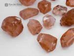 Fine rough golden topaz crystals from Pakistan. Showing warm amber color and natural brilliance.