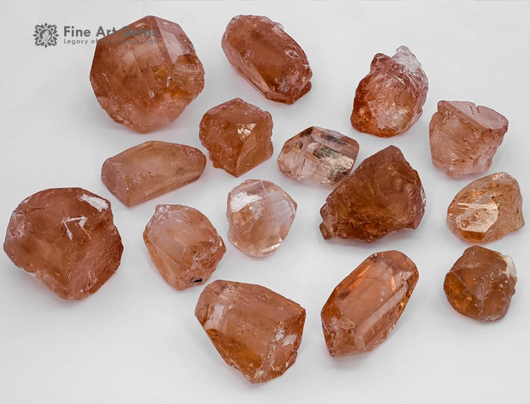 Fine rough golden topaz crystals from Pakistan. Showing warm amber color and natural brilliance.