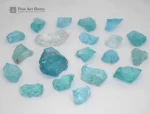 Fine rough aquamarine crystals from Madagascar show bright blue-green color and natural luster.