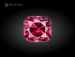 A 1-carat cushion-cut Rhodolite Garnet from Africa with a plum-pink tone, clear interior, and bright reflections from sharp faceting.