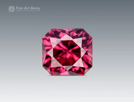 A 1-carat cushion-cut Rhodolite Garnet from Africa with a plum-pink tone, clear interior, and bright reflections from sharp faceting.