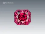 A 1-carat cushion-cut rhodolite garnet from Africa with vivid raspberry pink color, bright internal reflections, and clean faceting.