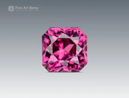 A 1.10-carat cushion-cut Rhodolite Garnet from Africa with a plum-pink tone, clear interior, and bright reflections from sharp faceting.