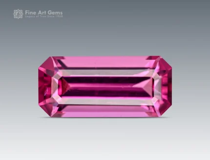 1.10 carat emerald cut rhodolite garnet gemstone with a bright pink-raspberry color.