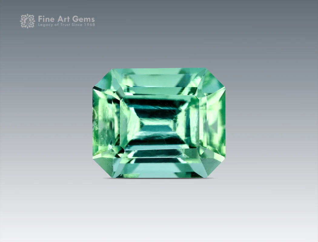 Light mint green emerald-cut tourmaline gemstone from Afghanistan, 1.40 carats, with sharp faceting and bright gemmy clarity.