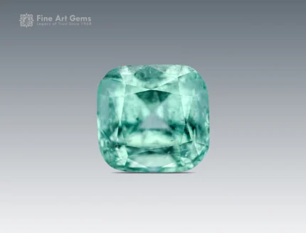 Natural light green Afghan tourmaline, 2.25 ct, cushion cut with visible inclusions.