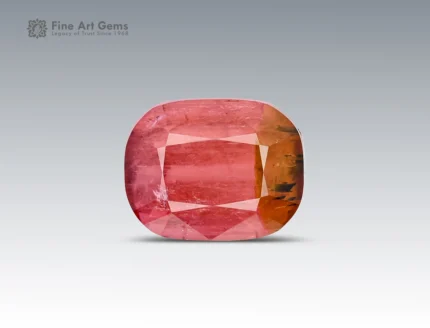 Bi-color cushion-cut tourmaline with natural color zoning, internal patterns, and balanced faceting from Afghanistan.