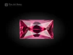 Baguette-cut rhodolite garnet gemstone with vivid raspberry color and sharp faceting from Africa.