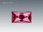 Baguette-cut rhodolite garnet gemstone with vivid raspberry color and sharp faceting from Africa.