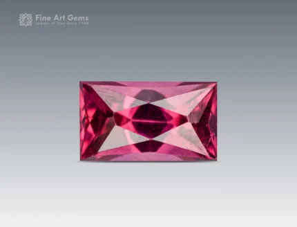 Baguette-cut rhodolite garnet gemstone with vivid raspberry color and sharp faceting from Africa.