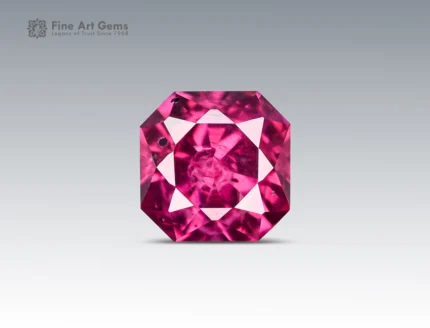 Faceted 1.45 carat cushion cut rhodolite garnet gemstone from Africa, showing rich raspberry color for acceptable jewelry use.