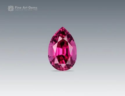 Pear-cut rhodolite garnet gemstone with vivid raspberry color and clean faceting from Africa.