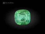 Green cushion-cut tourmaline with natural internal patterns and balanced faceting from Afghanistan.