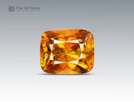 Faceted cushion-cut sphene gemstone showing golden-orange color and gemmy brilliance from Pakistan.