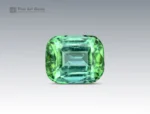 Green cushion-cut tourmaline with natural internal patterns and balanced faceting from Afghanistan.