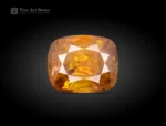 Faceted cushion-cut sphene gemstone with warm golden-orange color and gemmy brilliance from Pakistan.