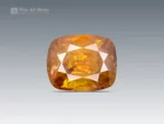 Faceted cushion-cut sphene gemstone with warm golden-orange color and gemmy brilliance from Pakistan.