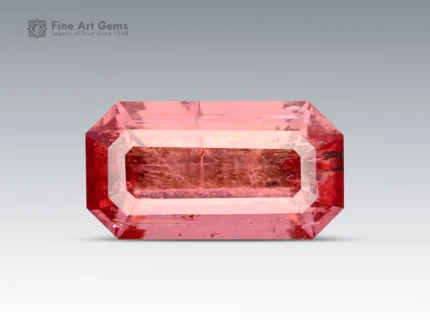 Hot pink emerald-cut tourmaline with vivid saturation, clean step faceting, and natural clarity from Afghanistan.