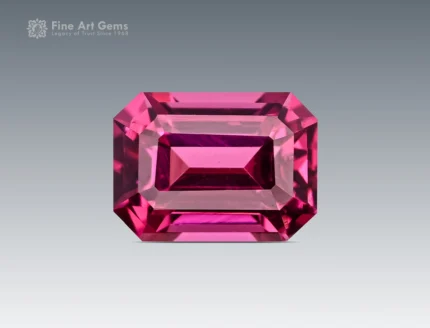 Vivid pinkish-red 1.20 carat emerald cut rhodolite garnet from Africa with excellent clarity and brilliance.