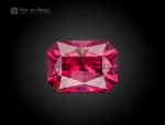 Fine cut cushion shape rhodolite garnet showing rich raspberry color and bright brilliance