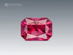 Fine cut cushion shape rhodolite garnet showing rich raspberry color and bright brilliance