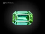 Emerald cut tourmaline gemstone showing blue and green tones with clean facet structure
