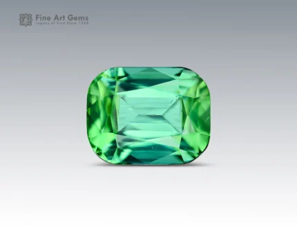 Natural cushion-cut mint-green tourmaline gemstone with lively brilliance and slight inclusions from Afghanistan.