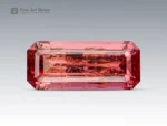 Emerald cut hot pink tourmaline gemstone from Afghanistan showing natural inclusions