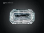 Natural emerald cut aquamarine gemstone with light blue color and visible inclusions from Pakistan.