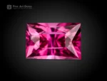 1.20 ct baguette cut rhodolite garnet showing vivid raspberry color and excellent clarity