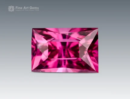 1.20 ct baguette cut rhodolite garnet showing vivid raspberry color and excellent clarity