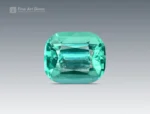 Cushion cut gemstone showing lagoon blue and green tones with natural clarity