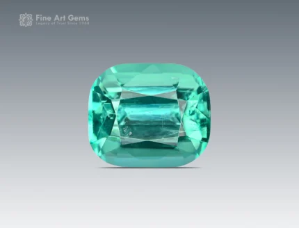 Cushion cut gemstone showing lagoon blue and green tones with natural clarity