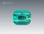 6.20 ct cushion cut gemstone showing lagoon blue and green tones with natural inclusions
