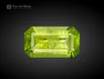 Emerald cut peridot gemstone with bright apple green color from Pakistan