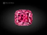 0.80 carat cushion cut rhodolite garnet from Africa with a hot pink color